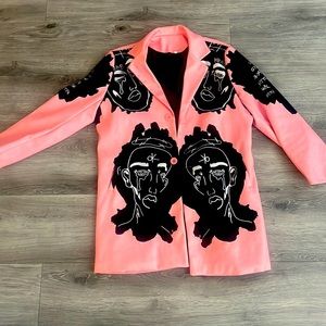 Graphic overcoat. Pink with black and white art. Light for spring or fall.